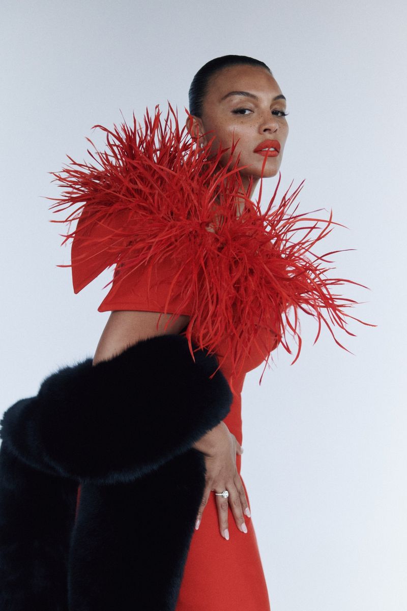 Image may contain Adult Person Accessories Jewelry Ring Face Head Photography Portrait Body Part Finger and Hand